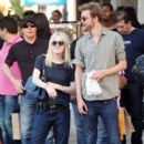 A smitten looking Dakota Fanning and her boyfriend Jamie Strachan go hand in hand for a stroll around New York City - 411 x 594