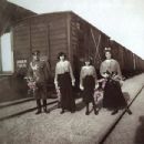 An officer and the Grand Duchesses Tatiana, Anastasia and Maria Nikolaevna of Russia pick blooming twigs from a shrub at the train station Alma (nowadays Pochtovoe) in the Crimea. - 454 x 434