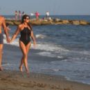 Ilaria D’Amico in Black Swimsuit on the beach in Marina di Massa - 454 x 297