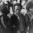 Devon Wilson with Miles Davis & Betty Davis at the funeral of Jimi Hendrix 1970