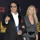 Gene Simmons and Shannon Tweed arrives at the 2007 American Music Awards held at the Nokia Theatre L.A. LIVE on November 18, 2007 in Los Angeles, California - 454 x 561