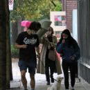 Camila Mendes – heads out with boyfriend Charles Melton for a rainy walk in Vancouver