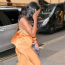 Kenya Moore &#8211; Wearing a bright orange dress at Bauer Media offices in London