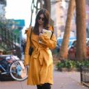 Emily Ratajkowski – In a yellow coat and zebra-striped boots in New York