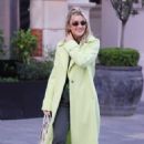 Ashley Roberts – In a lime green trench coat at Heart radio in London