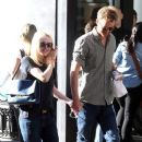 A smitten looking Dakota Fanning and her boyfriend Jamie Strachan go hand in hand for a stroll around New York City - 384 x 594