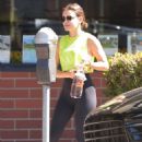 Lucy Hale – In a pair of yoga leggings and a fluorescent green top in Los Angeles