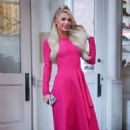 Paris Hilton – Wearing a pink dress as she heads to The Drew Barrymore Show in New York