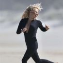 Pamela Anderson – Films Ultra Tune TV ad on Gold Coast Beach in Queensland