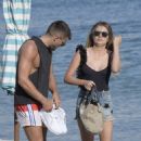 Chloe Lloyd in Black Swimsuit on the beach in Mykonos - 454 x 681