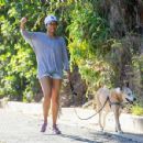 Regina King – Takes her dog out for a walk in Los Angeles