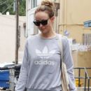 Olivia Wilde – Is seen carrying her workout trainers in Los Angeles