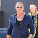 Sylvester Stallone poses with a group of fans while out running errands in Beverly Hills, California on March 28, 2017