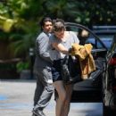 Milla Jovovich – Arrives at the Four Seasons in Los Angeles - 454 x 560