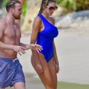 Zara McDermott – Wearing blue swimsuit on the beach in Barbados - 454 x 714
