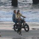 Kelly Gale – With Joel Kinnaman on the beach riding a Super73 electric bicycle in Venice - 454 x 303