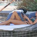 Raquel Leviss – Displays her green bikini at the pool in Scottsdale, Arizona - 454 x 302