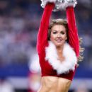 Dallas Cowboys Cheerleaders in Santa Suits – Performing an NFL football game in Arlington - 454 x 703