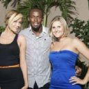 International track star Usain Bolt is sandwiched between designer Lubica Slovak (left) and Sandals International's Fiona Turner during a visit to Blue Beat's exclusive The Guest List party in Montego Bay last Saturday