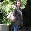 Milla Jovovich – Shopping candids on Melrose Place in West Hollywood - 454 x 681