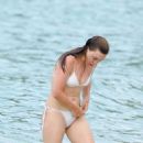 Melissa George – In white bikini on the beach in St. Barts - 454 x 681