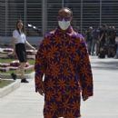 Lewis Hamilton puts on a vibrant display in a kooky printed outfit ahead of the Grand Prix in Bahrain...after revealing name change plans