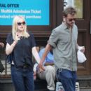 A smitten looking Dakota Fanning and her boyfriend Jamie Strachan go hand in hand for a stroll around New York City - 394 x 594