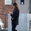 Kaia Gerber – Busy on her phone while leaving a studio in Los Angeles