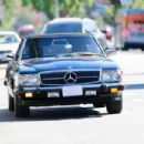 Olivia Wilde – Gets inside Harry Style’s vintage Benz in Los Angeles