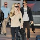 Amanda Seyfried(L) and actor Justin Long are seen upon arrival at Narita International Airport