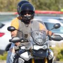 Diane Kruger with Norman Reedus riding a motorcycle in Malibu