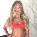 Victoria's Secret model Romee Strijd shows off her stunning figure in a bright orange bikini while in Palm Springs for Coachella