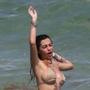 Malu Trevejo – In a gold bikini during a beach day in Miami - 454 x 680