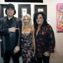 Gene Simmons poses in front of his acrylic on canvas work 