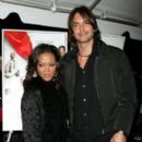 Robin Givens and Marcus Schenkenberg