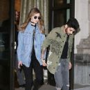 Reunited and it feels so good! Gigi Hadid and Zayn Malik hold hands as they leave their Milan hotel after nearly a month apart