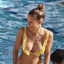 Annemarie Carpendale in Yellow Bikini on the pool in Miami