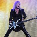 Rick Savage - During Def Leppard’s performance at the Cruzan Amphitheatre in West Palm Beach, Florida on June 15, 2011 - 454 x 567