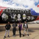 Black Eyed Peas performing on a Virgin Blue flight - 454 x 296