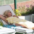 Denise Van Outen – In a bikini at a tennis club pool in Marbella - 454 x 302