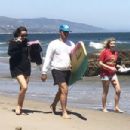 Dakota Johnson and Chris Martin on the beach in Malibu