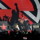 Tom Morello of Prophets of Rage performs onstage during KROQ Almost Acoustic Christmas 2017 at The Forum on December 9, 2017 in Inglewood, California - 454 x 309