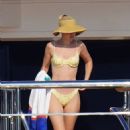 Gigi Hadid – Seen in a yellow bikini on a yacht in the bay of Saint-Tropez