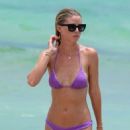 Baskin Champion in Purple Bikini at the beach in Miami