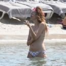 Nina Zilli and Omar Hassan – Seen on vacation on the beach in Provence-Alpes-Côte d’Azur - 454 x 303