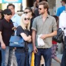 A smitten looking Dakota Fanning and her boyfriend Jamie Strachan go hand in hand for a stroll around New York City - 401 x 594