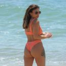 Kayleigh Morris – In orange bikini on the beach in Cyprus - 454 x 377
