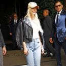 Anya Taylor-Joy – With Malcolm McRae check out of their hotel in New York
