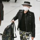 Cyndi Lauper – With husband David Thornton arrive at JFK Airport in New York - 454 x 521
