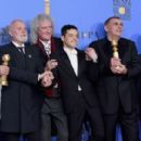 Jim Beach, Roger Taylor and Brian May of Queen, Best Actor in a Motion Picture Drama for 'Bohemian Rhapsody' winner Rami Malek,Producer Graham King, and Mike Myers At The 76th Annual Golden Globes (2019) - Press Room
